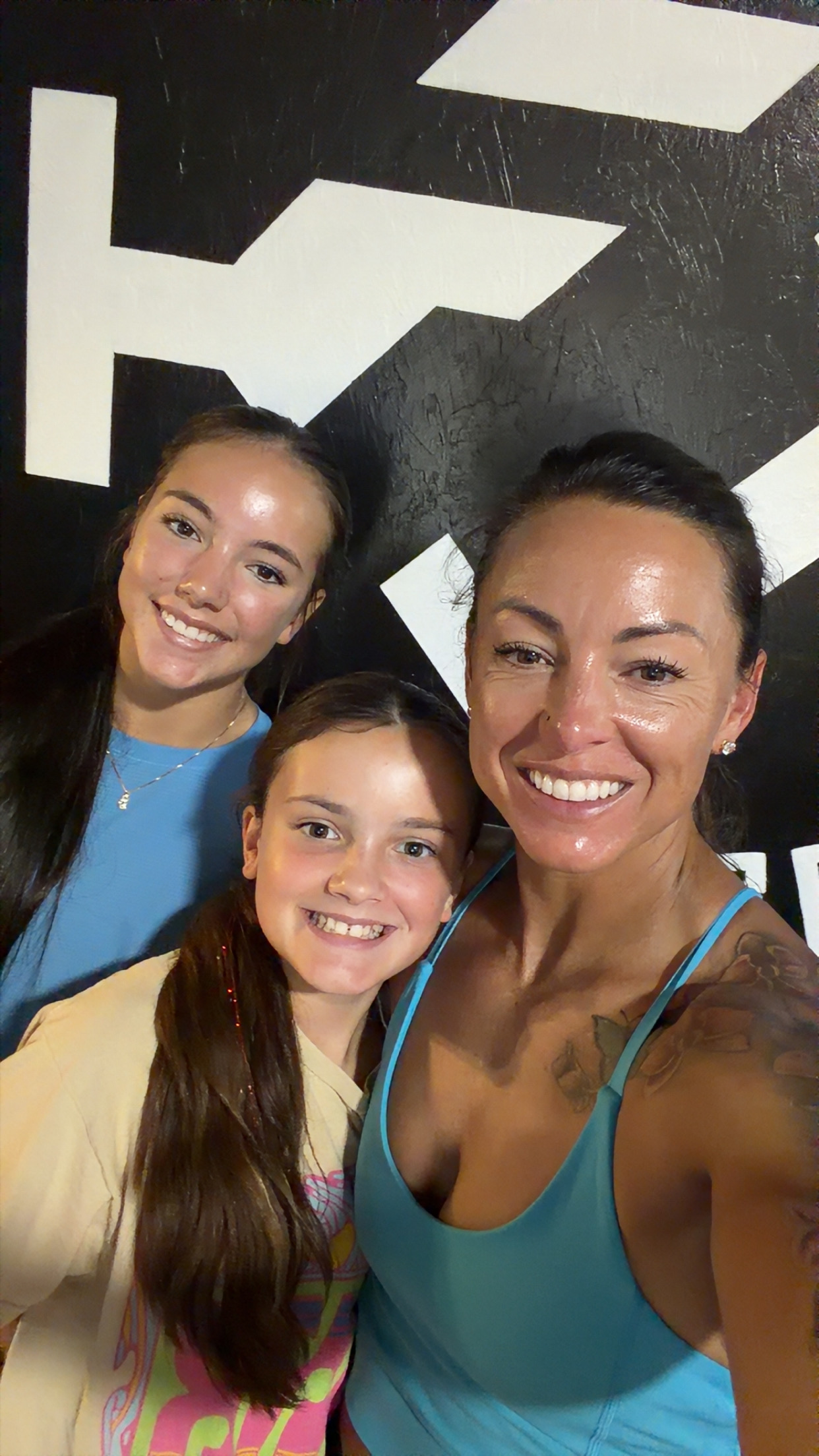 Alley with her daughters at the gym
